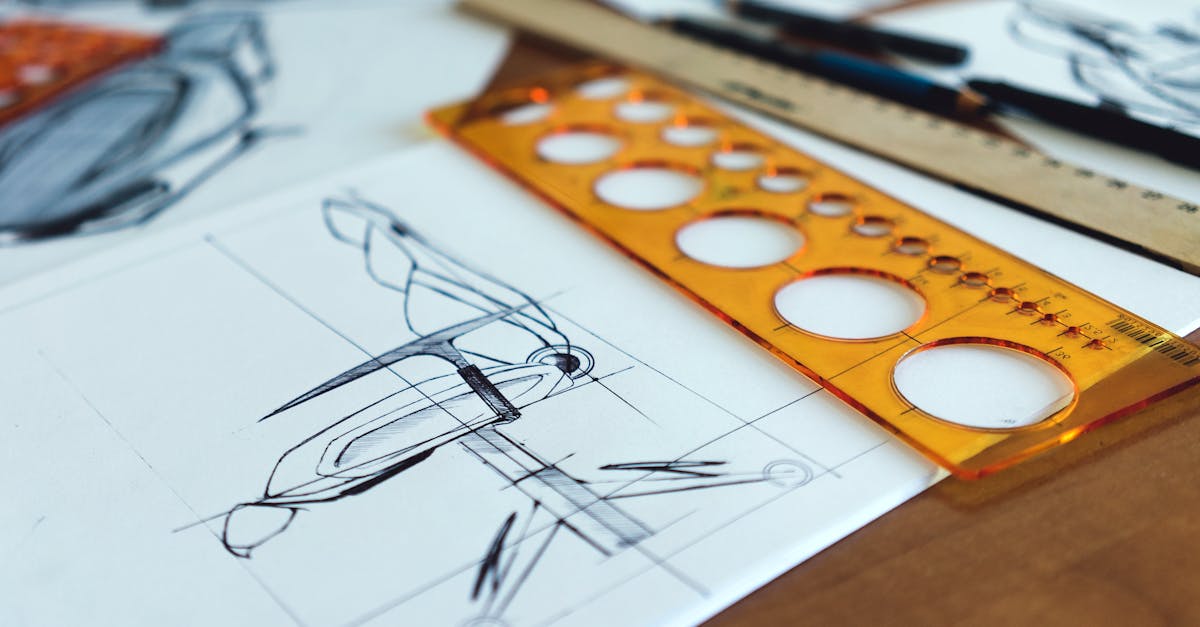 Detailed architectural drawings with design tools on a desk signify creativity and planning.