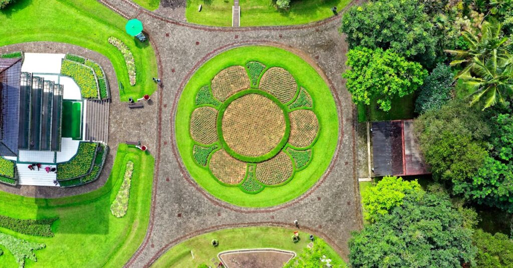 Aerial shot of a beautifully landscaped garden in Sukaresmi, Indonesia, with geometric patterns.